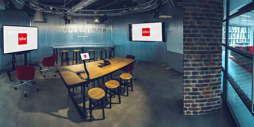 Large, industrial-looking board room at Infor, London