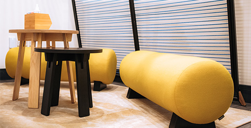 Comfy yellow seating in MPB breakout area