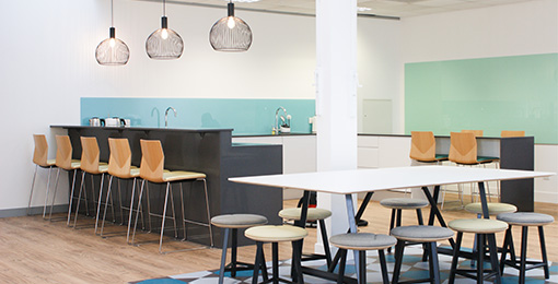 Kitchen area in office remodel by Mobius At Work