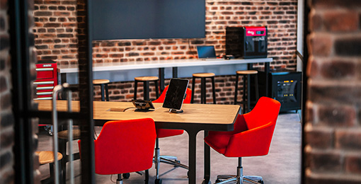 Red chairs in office meeting room