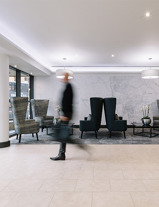 Man passing through reception in Savills office