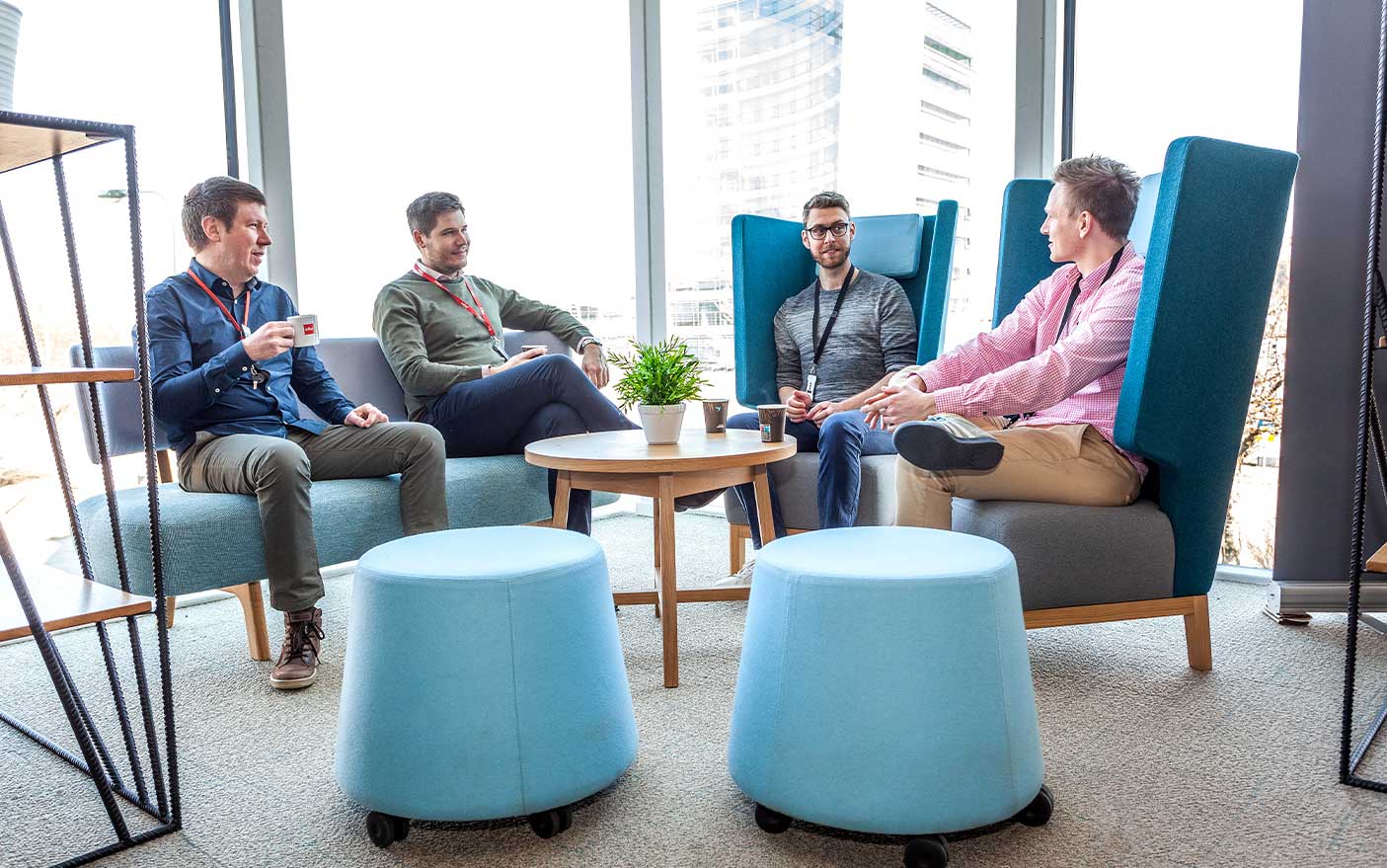Co-workers meeting in a fresh-looking breakout area, supplied by Mobius At Work