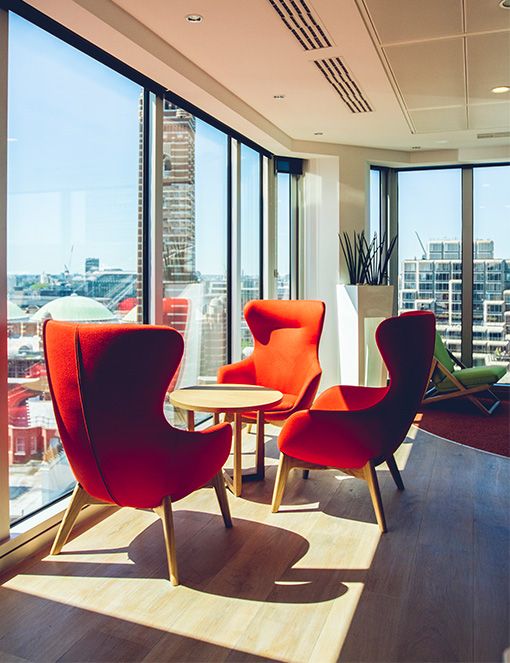 Sun shining onto small meeting area in open plan office