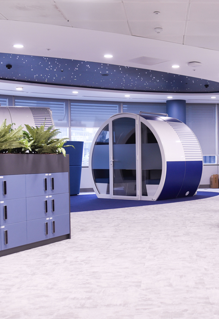 Existing ceiling feature was transformed into a “starry sky.” Spacecraft-themed meeting pods sit directly below